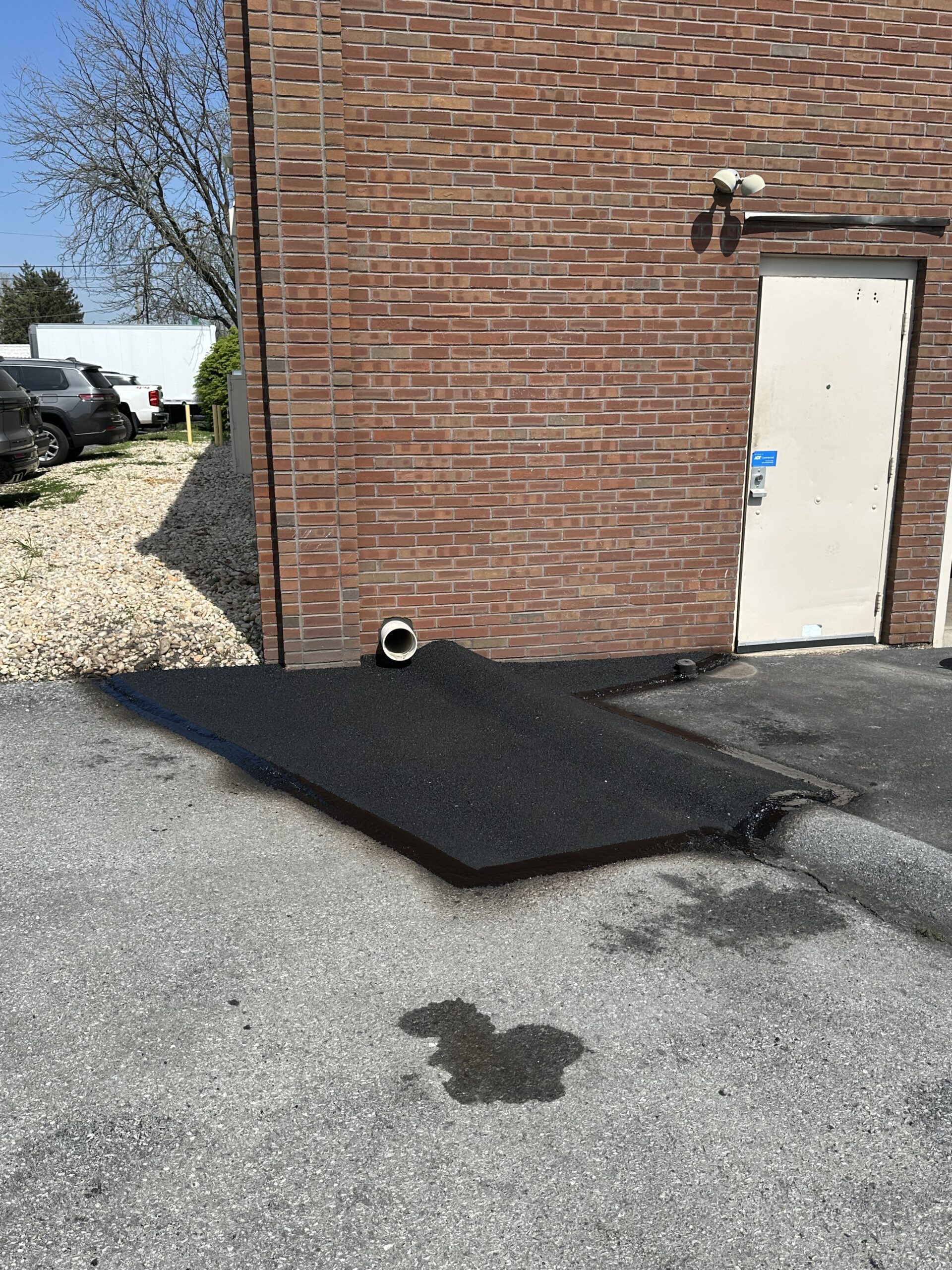 Asphalt Patching in Palmyra That Protected a Drainage Area Before Cracks Spread