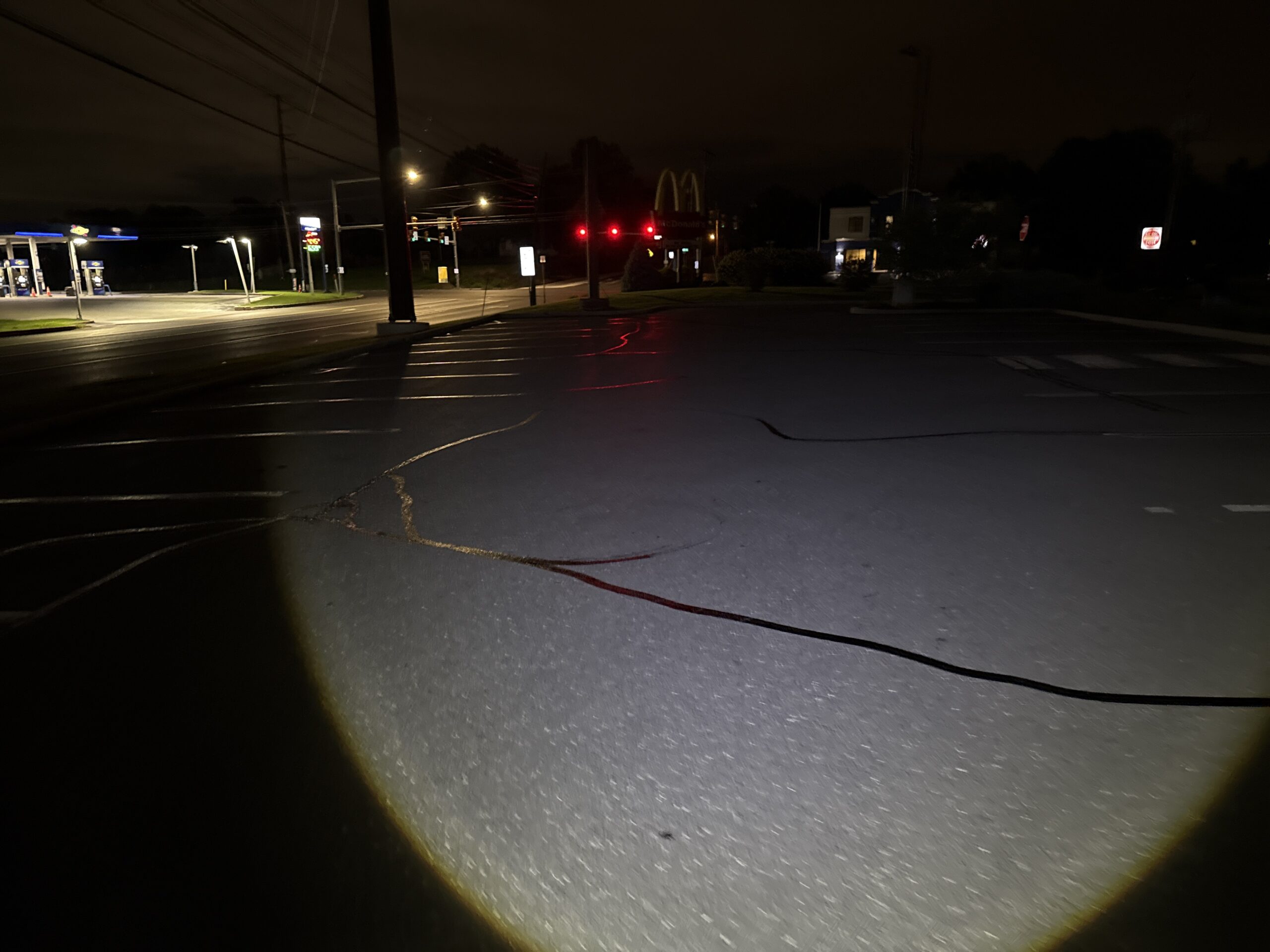 Crack Sealing After Dark at a McDonald’s Parking Lot in Camp Hill, PA
